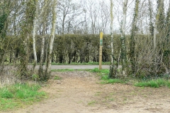 12:51 : Where the good way marking shows again.  "Turn Left along track for 75m, and then turn Right into wide enclosed path.  Forward, hedge right to field corner. Turn Left and continue hedge right with playing field on your right ..."